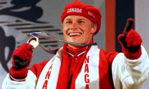 Men's Giant Slalom Snowboard gold medal winner Ross Rebagliati of Canada shows his delight during the medal ceremony at the XVIII Winter Olympic Games, February 8, 1998. (Photo by Dylan Martinez/Reuters)